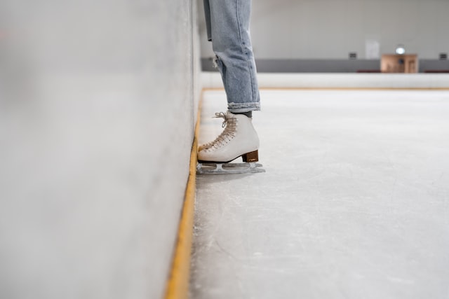 person standing on the ice in shoes